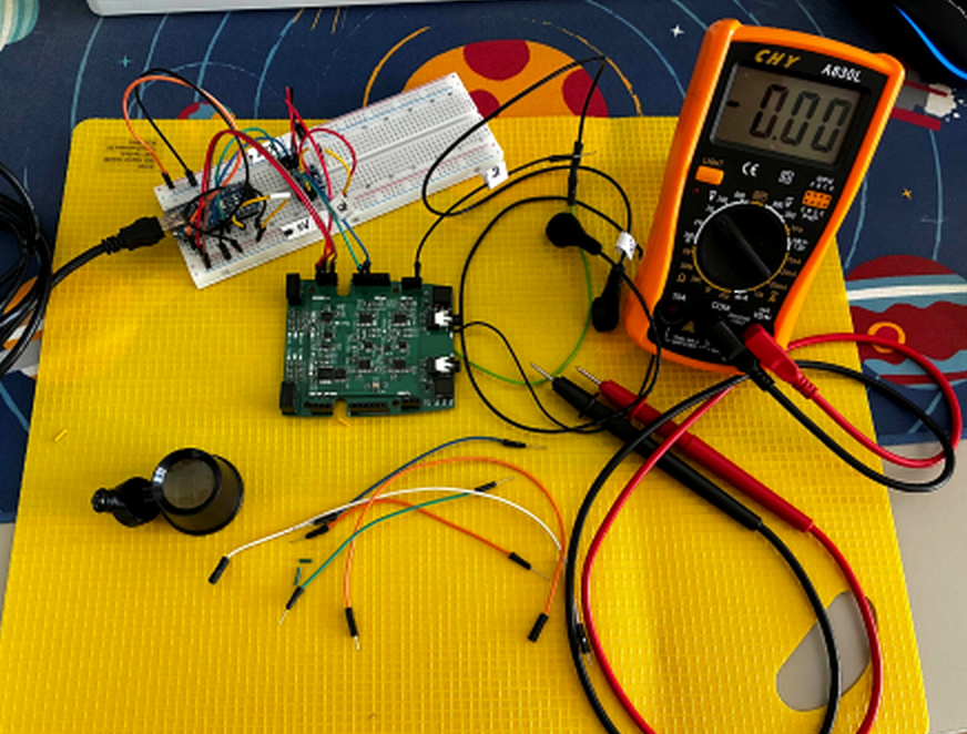 Electronics prototype and measurement equipment on a laboratory bench